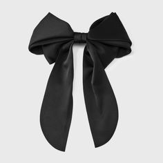 Style your day-to-day look with this Satin Bow Hair Barrette from A New Day™. This satin bow hair barrette in a solid color makes a versatile choice to match your favorite outfit. It's decorated with a big bow that has long tails for charming appeal. The back metal clip provides a strong hold to neatly style your hair, and it's suitable for all hair types. A New Day™: Style that goes wherever you do. Black Bow Hair Clip, Black Bow In Hair, Gracie Abrams Bow, Black Hair Ribbon, Black Bow Hair, Black Hair Bow, Iconic Christmas, Alice Costume, Black Hair Bows