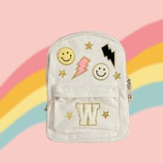 "Customizable kids / toddler natural colored canvas backpack / iron-on patches  THIS IS NOT A STANDARD SIZE BACKPACK PLEASE READ DIMENSIONS Includes patches shown with your choice of initial letter Dimensions:  -Width: 9 3/4\" -Height: 12 3/8\" -Length: 3\" **spot clean only" Stoney Clover Backpack Ideas, School Backpack With Logo Patch, Standard School Backpack With Logo Patch, Trendy Backpack For School Events, White Canvas Backpack For Back To School, School Bag With Letter Patch For Back To School, School Bags With Letter Patch For Back To School, Back To School Bags With Letter Patch, White Standard Backpack For School Events