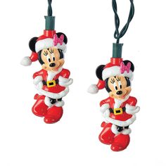 two mickey mouse ornament hanging from strings on a white background, one wearing a santa hat and the other in red