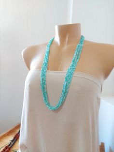 "Turquoise and mint necklace.  Need a specific length? We have them all! It has 8 strands.  Size shown in pictures is 30\".  Please read specifications on SIZES below: ❤ SIZES This item comes in several sizes, kindly choose at checkout. The easiest way to find out which length suits you best is to measure a necklace you already own, from one end to the next, including clasp. You can also use the diagram on the pictures as a reference, but keep in mind that we all have different neck and body sizes. If you'd like a clasp extender, please add this to the cart: https://www.etsy.com/listing/187503833/clasp-extender.  ❤ PROCESSING AND SHIPPING Most orders are made and shipped out in one business day. Please check delivery timeframes for your location on the description below.  ❤ CUSTOM ORDERS I Turquoise Multi-strand Beaded Necklaces With Tiny Beads, Turquoise Multi-strand Tiny Beads Necklace, Turquoise Multi-strand Beaded Necklaces, Turquoise Multi-strand Tiny Beads, Turquoise Multi-strand Necklaces For The Beach, Turquoise Multi-strand Necklace For Beach, Turquoise Beaded Necklace For The Beach, Turquoise Long Beaded Necklace For Beach, Turquoise Beaded Multi-strand Layered Necklace