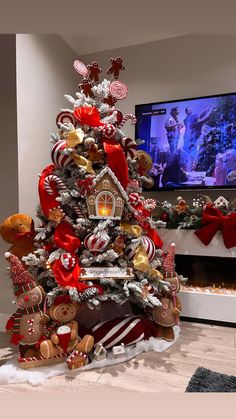 a christmas tree decorated with gingerbreads, candy canes and other holiday decorations