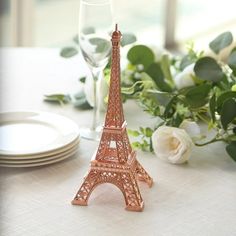 there is a small model of the eiffel tower on top of a table