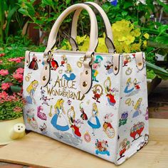 Buy Alice In Wonderland Disney Leather HandBag is designed & sold by Wayfarer Bumper. SKU 87475825 listed on 10 16, 2023. Most ship worldwide within 24 hours. Delivery to the United States. Leather Bag Women Handbags, Personalized Leather Handbag, Custom Leather Bag, Friends Women, Alice In Wonderland Disney, Wallet Cute, Woman Handbag, Bags And Purses, Student Bag