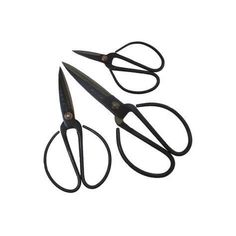 three pairs of scissors sitting on top of each other