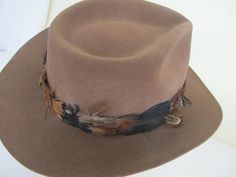 "Vintage Tiger of Sweden Outback Style Hat Made by Gil Truedsson Out of a ranch here in the Sierra's Top notch. For your steppin' out hat... Spectacular and extraordinary hat for the stylin' guy 5\" high 3\" brim. Feather hat band 23\" The color is a beautiful brown White satin lining Interior band is leather Excellent condition...barely worn Don't miss this one! Sharp! https://www.etsy.com/shop/BelindasStyleShop" Cowboy Hat Feather, Cowboy Hat Brown, Feather Hat Band, Vintage Cowboy Hat, Headband Hat, Opera Coat, Velvet Cape, Vintage Tiger, Vintage Goth