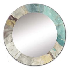 a round mirror with blue and gold paint on it