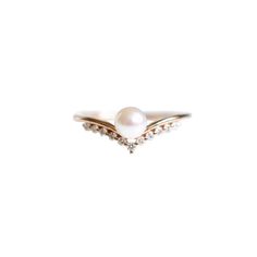 a pearl and diamond ring on a white background