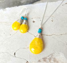 "This beautiful yellow and turquoise necklace and earring set will add a pop of color to any outfit.  A great addition to your spring, summer or fall wardrobe.  I generously wire wrapped each yellow howlite briolette shaped stone with non-tarnish sterling silver wire and added a tiny turquoise stone.  The earrings measure just over 1  1/2\" in length from the top of the sterling silver earwires.  The pendant is slightly larger than the earrings measuring 1 3/4\" in length and 3/4\" in width. The Vibrant Yellow Dangle Earrings, Handmade Vibrant Yellow Jewelry, Vibrant Handmade Yellow Jewelry, Vibrant Yellow Handmade Jewelry, Turquoise Jewelry Set, Yellow And Turquoise, Yellow Necklace, Yellow Jewelry, Beaded Boxes