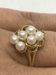 VINTAGE GORGEOUS 14K YELLOW GOLD PEARL AND DIAMOND CLUSTER RING Size 6.25 REALLY STUNNING! Ring features 6 - 3mm pearls and 3 small bright genuine diamonds! Set in solid 14K yellow gold. 2.6 grams Size 6 Please message me with any questions I am open to offers : ) Shipped insured/delivery confirmation I guarantee item to be exactly as described and pictured. Vintage 14k Gold Pearl Ring, Vintage Gold Hallmarked Pearl Ring, Vintage Yellow Gold Pearl Ring, Vintage White Pearl Ring Stamped 14k, Gold Cluster Pearl Ring For Formal Occasions, Cluster Yellow Gold Pearl Ring For Anniversary, Gold Cluster Pearl Ring Gift, Ruby Heart Pendant, Black Opal Pendant