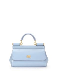 This chic little number in light blue is perfect for those who love a pop of color in their accessory collection. Made from shiny calfskin leather, it’s both stylish and versatile, fitting right in whether you're headed to brunch or a night out. Plus, it’s got just the right amount of space for all your essentials without weighing you down. Adjustable and detachable shoulder strap Front flap with concealed double magnetic button closure Logo plaque on the front for a touch of elegance Internal f Leopard Print Fabric, Top Handle Handbags, Leather Cap, Chic Accessories, Logo Stamp, Leather Mini, Blue Bags, Handbag Backpack, Small Bag