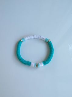 Our beautiful handmade bracelets are stretchable so will fit most children's and adults wrist sizes comfortably.   SIZING: Our bracelets are approximately 16-18 cm in length.     Please don't overstretch the bracelets as they will only stretch so far and may snap.  More colours coming soon!  If you have any questions please message us! :) Adjustable Blue Stackable Stretch Bracelet, Blue Adjustable Stackable Stretch Bracelet, Summer Heishi Beads Stretch Bracelet For Friendship, Stackable Stretch Bracelet For Summer, Summer Stackable Stretch Bracelet, Trendy Turquoise Stretch Bracelet With Letter Beads, Playful White Heishi Beads Stretch Bracelet, Playful Adjustable Stretch Bangle Bracelet, Flexible Blue Summer Bracelet