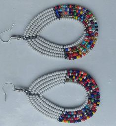 This is an African beaded earrings made using beads and beading wire. It's a good piece to match most of your outfits. Carefully handcrafted thus strong and durable. Gladiator Shoes, African Earrings, Handmade Sandals, Beaded Sandals, Leather Sandals Flat, Earrings Beaded, Maasai, Leather Sandals Women, African Beads