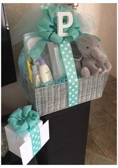 a baby gift basket sitting on top of a dresser