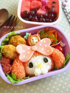 two plastic containers filled with food on top of a table