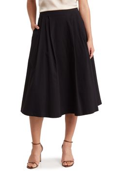 Every smart wardrobe needs this versatile midi skirt that takes you from desk to dinner with ease. 30" length (size Small) 76% rayon, 21% nylon, 3% spandex Machine wash, line dry Made in the USA Model stats: 5'10" height, 32" bust, 25" waist, 36" hip. Model is wearing size Small. Smart Wardrobe, Festival Must Haves, Prom Shopping, Wardrobe Needs, Womens Business Casual, Black Midi Skirt, Black Midi, Pleated Midi Skirt, Women Skirts Midi