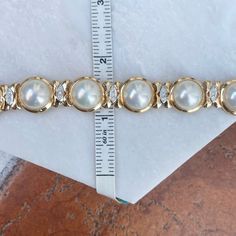 Estate/ vintage 14KT yellow gold polished, Mabe pearl links with diamond detailing bracelet. Elegant and high-end piece! Length: 7" Width: 15mm Weight: 42.6 grams Finished back Push in Clasp Double Safety Clasp .59 carat pave diamonds (27) round diamonds SI clarity; G/H color color diamonds Excellent estate condition Classic Gold Diamond Pearl Bracelet, Classic Gold Pearl Bracelet With Diamonds, Classic Diamond Pearl Bracelet For Formal Occasions, Gold Diamond Pearl Bracelet For Anniversary, Diamond Pearl Bracelet In Yellow Gold For Anniversary, Yellow Gold Diamond Pearl Bracelet For Anniversary, Luxury Yellow Gold Bracelets With Pearl Drop, Vintage Yellow Gold Pearl Bracelet For Formal Occasions, Luxury 14k Yellow Gold Pearl Bracelet