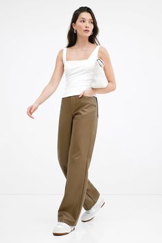 A force of nature in stretchy faux leather with a high-sheen finish, our Julien Pants offer a luxe feel to any look. Perfect for year-round wear, we've designed Julien with a wide-leg, high-rise cut and a distinctive horizontal seam at the knees. She'll elevate wherever and whenever you wear her. Also available in latte.[SPLIT] Rocio is 5'9.5" (175 cm) tall, wearing size XS. Total length from below the waist is approximately 42.5" (108 cm). Inseam length is approximately 33" (84 cm). Vegan Leath Sleek Wide Leg Leather Pants For Spring, Faux Leather Wide Leg Pants For Work, Trendy Wide-leg Leather Pants, Chic Leather Wide Leg Pants, Chic Wide Leg Faux Leather Pants, Spring Wide-leg Faux Leather Pants, Faux Leather Wide-leg Pants For Spring, Chic Wide-leg Faux Leather Pants, Chic Wide-leg Leather Pants