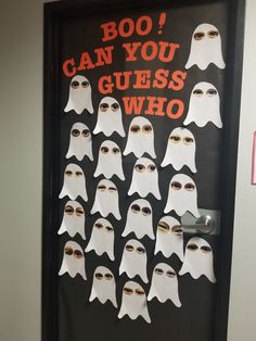 a door decorated with white ghost faces and the words boo can you guess who?