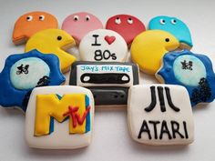 decorated cookies are arranged in the shape of an i love 80's mix tape