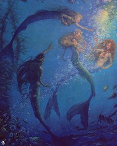 two mermaids are swimming in the water