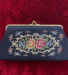 ◦ Step into the captivating allure of the past with our Vintage Old Embroidered Purse, a truly remarkable piece handcrafted on black cotton in the 1970s. This collectible accessory serves as a tangible link to history, boasting intricate hand-embroidery that pays homage to the timeless art of craftsmanship. In excellent condition, this small yet significant hand-embroidered pouch exudes an irresistible vintage charm that effortlessly merges past and present. Adding to its appeal, the interior of Embroidered Pouch, Embroidery Purse, Embroidered Purse, Framed Embroidery, Cotton Embroidery, Timeless Art, Small Hands, Coin Purses, Small Bags