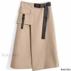 Katykey - Chic Beige High-Waisted Split Irregular Midi Skirt - Figure-Flattering and Knee Length Spring Bottoms With Belt Loops And Asymmetrical Hem, Chic Bottoms With Belt Loops And Asymmetrical Hem, Asymmetrical Cargo Skirt For Spring Workwear, Spring Asymmetrical Cargo Skirt For Work, Spring Asymmetrical Skirt With Belt Loops, Fall Asymmetrical Skirt With Belt Loops, Beige Asymmetrical Hem Bottoms For Fall, Chic Asymmetrical Skirt With Pockets, Casual Asymmetrical Beige Skirt