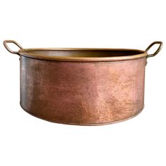 an old fashioned metal pot with handles