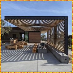 an outdoor covered patio with furniture and wood slats