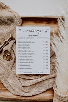 the wedding game is laid out on a wooden board with some scissors and other items