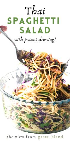 spaghetti salad in a glass bowl with spoons