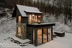 a small cabin in the middle of a snow covered forest with lights on it's windows