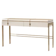 a white and gold desk with two drawers on it's sides, against a white background