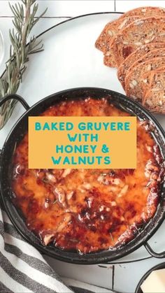 baked gruyre with honey and walnuts in a skillet next to sliced bread