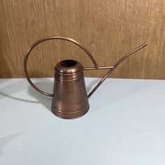 an old fashioned metal coffee pot on a table