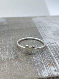 Sterling silver heart ring A sweet little heart ring made of sterling silver. Sterling Silver Heart Ring, Heart Silver Ring, Simple Ring Designs Silver, Simple Silver Rings, Simple Ring Design, Ring With Heart, College Checklist, Simple Silver Jewelry, Silver Rings Simple