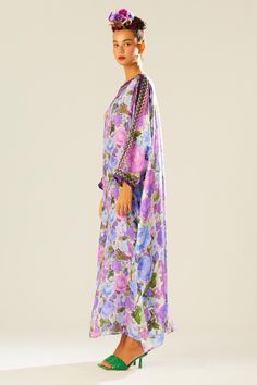 Purple kimono kaftan with floral pattern and geometric panel.
Components: 1
Type Of Work: Floral
Neckline: Boat
Sleeve Type: Flared
Fabric: Silk
Color: Purple
Other Details: 
Draped silhouette
Occasion: Resort - Aza Fashions Floral Print Long Sleeve Kaftan For Eid, Long Sleeve Floral Print Kaftan For Eid, Floral Print Maxi Kaftan For Eid, Floral Print Kaftan For Eid Vacation, Bohemian Floral Print Floor-length Kaftan, Floor-length Floral Print Kaftan For Spring, Bohemian Floor-length Floral Print Kaftan, Spring Floral Print Floor-length Kaftan, Purple Maxi Length Kaftan For Eid