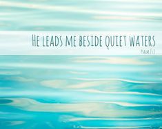 the water is reflecting blue and white with a quote above it that reads, he leads me beside quiet waters