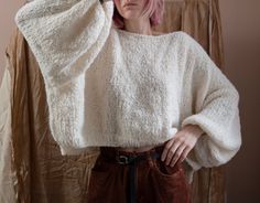 "Super soft and lightweight sweater with balloon sleeves from alpaca/wool blend. Materials: 80% Alpaca, 15% Wool, 5% Polyamide Color of the modeled sweater: off white; ocean Measurements: Length: front 17,7\" = 45 cm back 19,6\" = 48 cm Chest: 32\" = 81 cm Measures of Model in the photo Size: S Chest: 32\" - 82 cm Weist: 24\" - 62 сm Hip: 34\" - 88 cm Height: 66\" - 170 cm CARE INSTRUCTIONS: DRY CLEAN is the best way. HAND WASH. Make sure to use cold water and neutral soap. The less you touch an Oversized Knit Sweater With Balloon Sleeves, Oversized Alpaca Soft Knit Sweater, Oversized Soft Knit Alpaca Sweater, Cozy Sweater With Balloon Sleeves And Soft Knit, Cozy Balloon Sleeve Sweater, Oversized Soft Knit Sweater With Balloon Sleeves, Oversized Balloon Sleeve Sweater In Soft Knit, Oversized Alpaca Chunky Knit Sweater, Oversized Chunky Knit Alpaca Sweater