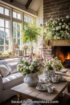 a living room filled with lots of furniture and flowers in vases on top of a table