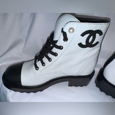 Nib; 100% Authentic; White And Black Leather; 39.5 Size; Pearl Accent; Silver Hardware; Black Laces; White Flat Heel Boots For Streetwear, White Lace-up Boots With Leather Sole, Luxury White Sneakers With Rubber Heel Cap, Casual White Boots With Rubber Heel Cap, Sporty White Leather Boots, White Calf Leather Boots With Round Toe, White Ankle-high Boots With Contrast Sole, White Almond Toe Boots With Branded Insole, White Sporty Ankle-high Boots