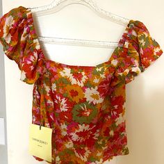 This Nwt Cynthia Rowley Floral Smocked Orange Pink Green Gold Crop Top Small Is In Perfect Condition! Zero Holes, Tears, Stains Or Defects Whatsoever. Side Zip And Smocking Make It Easy To Fit This Cute And Versatile Top! Looks Great With High Waist Shorts, Pants, And Skirts. Spring Multicolor Smocked Top With Ruffles, Multicolor Smocked Top For Beach In Summer, Multicolor Smocked Top For Beach Summer, Multicolor Smocked Top With Ruffles For Spring, Multicolor Smocked Top For Beach And Summer, Multicolor Smocked Back Summer Top, Multicolor Smocked Top For Vacation, Spring Multicolor Smocked Top With Smocked Back, Pink Bohemian Smocked Top For Summer