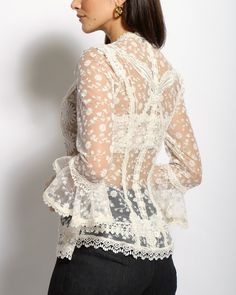 The Colette lace blouse features a delicate fitted V neckline top with ¾ sleeves and Venise lace collage all thru-out. The Colette comes with a lace bralette. Cotton and Rayon tulle lace Five satin buttons along bustline center front Dry clean only Each piece is made to order and handcrafted in our atelier. Slight variations may occur as each piece is unique. Spring Formal Lace Patchwork Top, Spring Long Sleeve Lace With Lace Trim, Fitted Long Sleeve Lace Top With Delicate Lace, Chic Fitted Lace, Spring Lace Blouse With 3/4 Sleeves, Lace Blouse With 3/4 Sleeves For Spring, Lace Blouse With Three-quarter Sleeves For Spring, Elegant Long Sleeve Spring Lace, Elegant Long Sleeve Lace For Spring