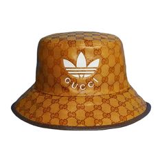 Excellent Condition. Never Worn!! Brown Coated Canvas Gucci X Adidas Monogram Bucket Hat With Logo Throughout, Canvas At Lining, And Leather Trim At Brim. Fabric: 67% Polyamide, 33% Cotton; Lining 65% Cotton, 35% Linen; Combo 55% Cotton, 45% Viscose; Embellishment 100% Calfskin Color: Brown Designer, Gucci, Adidas, Streetwear, Bucket Hat, Designer Bucket Hat Gucci Brown Curved Brim Hat, Gucci Brown Short Brim Hat, Brown Gucci Cap Hat, Designer Brown Hat With Embroidered Logo, Gucci Designer Wide Brim Hat, Gucci Adjustable Bucket Hat, Luxury Brown Hat With Embroidered Logo, Classic Gucci Hat With Embroidered Logo, Designer Gucci Hats With Embroidered Logo