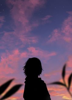 the silhouette of a person standing in front of a purple sky