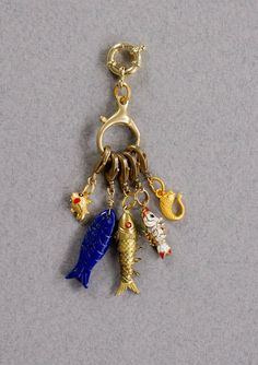 FIVE FISH CHARMS Five fish charms hang from a charm holder.  These charms can easily be attached to any of your favorite necklaces. ITEM DETAILS: * Gold plated fish. Lapis fish. Enamel fish. * Clasps: Brass and gold plated. * Length: 3.5 inches including the two clasps. * TO BUILD YOUR OWN CHARM BRACELET OR NECKLACE, PLEASE VISIT     MY CHAIN NECKLACE AND BRACELET SECTION.  PROCESSING TIME: * 4-6  business days.  All the jewelry on my site is made by me with love and care. ❤️ GIFT WRAP OPTION: * You can select gift wrap option. Your gift will arrive in a branded Alison Storry Jewelry pouch inside a branded box. You can also request a message to be included on a small card. SPECIAL OFFERS: You can sign up to my news letter to hear about upcoming sales, new offers and new collections. http:/ Cheap Charm Necklace With Lobster Clasp For Friendship, Cheap Friendship Charm Necklace With Lobster Clasp, Luxury Charm Necklaces With Lobster Clasp As A Gift, Cheap Alloy Charm Necklace With Lobster Clasp, Luxury Charm Necklaces With Lobster Clasp, Luxury Charms With Lobster Clasp For Gift, Necklaces Charms, Fish Bracelet, Articulated Fish