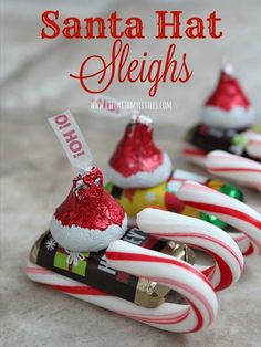 santa hat sleighs made out of candy canes and other holiday decorations