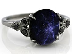 4.75ct Oval Cabochon Star Sapphire With .10ctw Round Black Spinel, Black Rhodium Over Sterling Silver Ring. Measures Approximately 34"L x 0.43"W. Not sizeable. Celestial Sapphire Sterling Silver Rings, Star Saphire Ring, Gothic Sapphire Jewelry, Gothic Sapphire Ring, Star Sapphire Ring Vintage, Celestial Star-shaped Sapphire Gemstone Ring, Celestial Blue Cabochon Ring, Star Sapphire Jewelry, Black Sapphire Ring