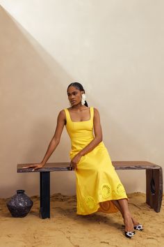 Elevate your summer style with our Kwara Dress. Hand-crafted by artists in Nigeria, this sundress features stunning crochet details along the hem. With a square neck and sleeveless design, this 100% cotton dress is perfect for your next weekend getaway. Stay cool and stylish with this must-have piece with pockets. Dry clean only Size up if in between sizes Colour may vary due to lighting on images Summer Midi Dress With Cutwork Hem, Summer Vacation Dresses With Cutwork Hem, Summer Vacation Dress With Cutwork Hem, Summer Beach Dress With Cutwork Hem, Summer Beach Dresses With Cutwork Hem, Square Neck Cotton Sundress For Vacation, Sleeveless Cutwork Hem Dress For Vacation, Sleeveless Dress With Cutwork Hem For Vacation, Beach Midi Dress With Straight Neckline