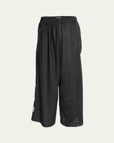 Balenciaga shorts in striped mesh    Elasticized waist    Side welt pockets    Unity flame logo on sides    Baggy legs    Pullon style    Polyester    Hand wash    Made in Italy Black Moisture-wicking Knee-length Shorts, Sports Bermuda Bottoms With Elastic Waistband, Black Bottoms With Elastic Side Panels, Sporty Knee-length Shorts With Side Pockets, Relaxed Fit Bermuda Bottoms For Sports, Black Bottoms With Elastic Side Panels, Short Length, Sporty Bermuda Bottoms With Elastic Waistband, Sporty Short Pants With Side Pockets, Knee-length Athleisure Shorts For Streetwear