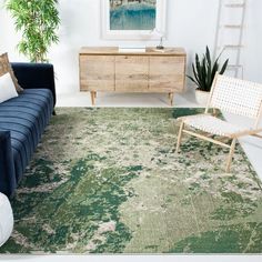 a living room filled with furniture and a green rug